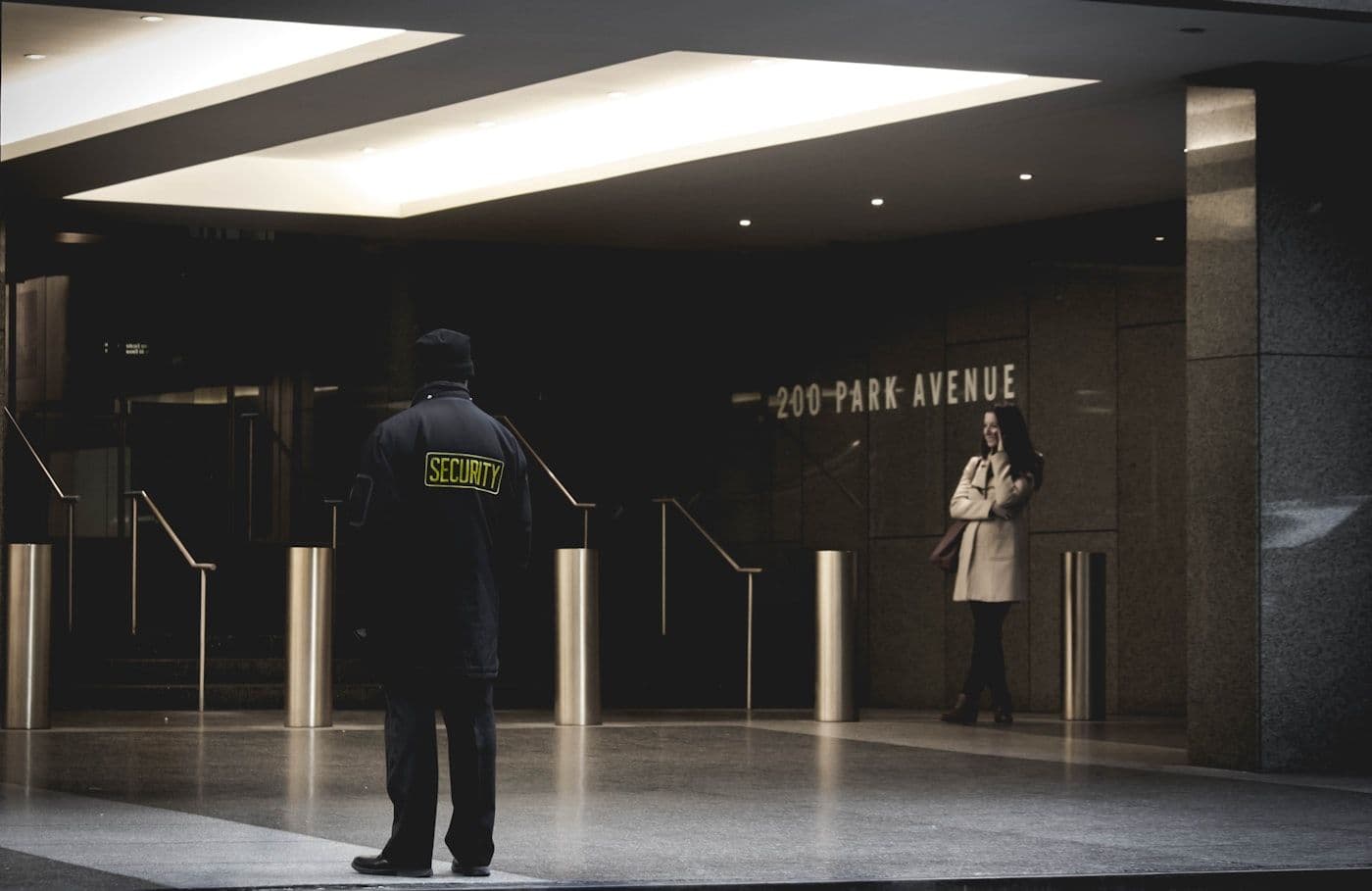 Security officer monitoring a commercial entrance